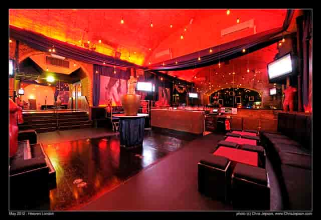 Vibrant event space with warm lighting, ideal for networking and live entertainment.
