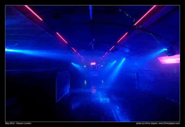 Dynamic event space with vibrant blue and purple lighting for nightlife and themed parties.