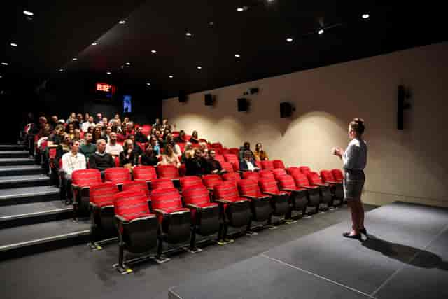 Cubic Theatre at London Transport Museum, tiered red chairs for presentations and workshops.