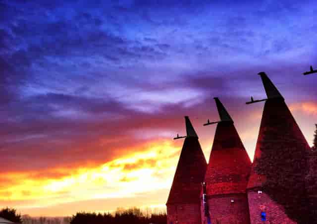 Dray Marquee at Hop Farm with conical structures, perfect for sunset events and receptions.
