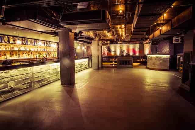 Stylish event space in Forge with a sleek bar, ideal for parties and networking.