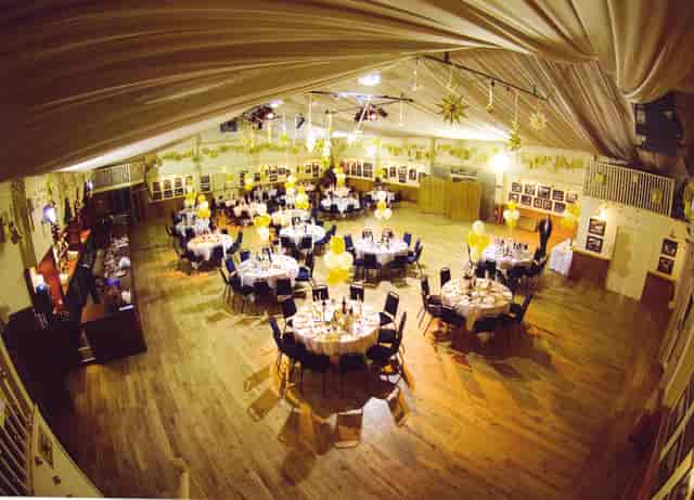 Elegant event venue at The Dray, featuring round tables for weddings and corporate gatherings.