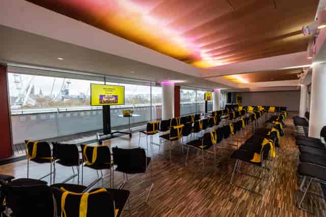 Weston Roof Pavilion seminar space with black chairs, ideal for corporate events and workshops.
