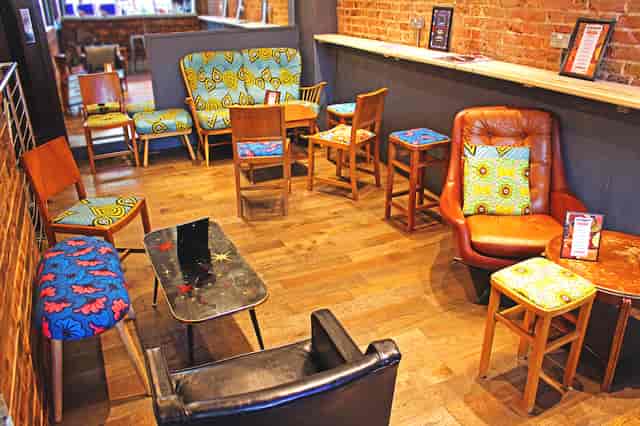 Cozy eclectic seating area in The Nightclub, perfect for networking events and meetings.