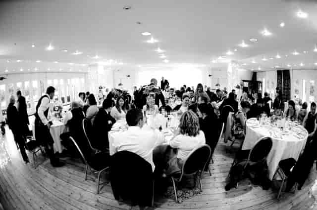 Elegant Britannia Suite event space with guests dining, perfect for celebrations.