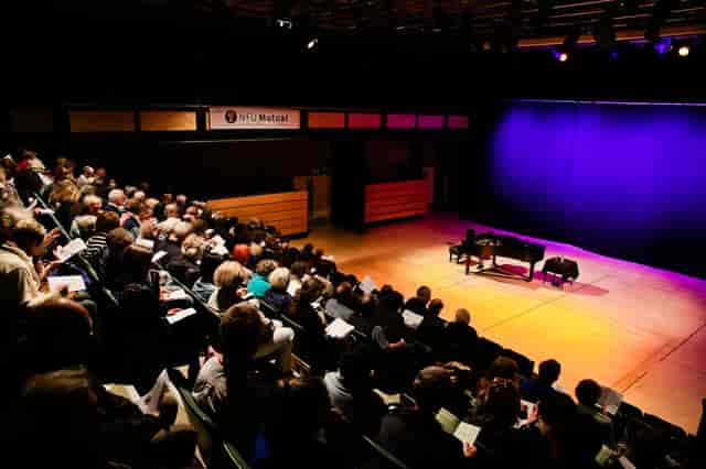 Ellis Theatre auditorium with grand piano, set for a performance event.