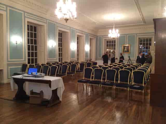 Meeting room at The Adderley, Marlborough College, with blue chairs for events and presentations.