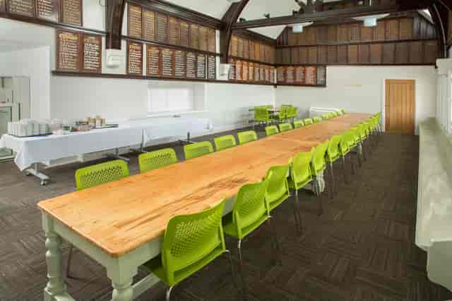 Cricket Pavilion meeting room with wooden table, ideal for workshops and team events.