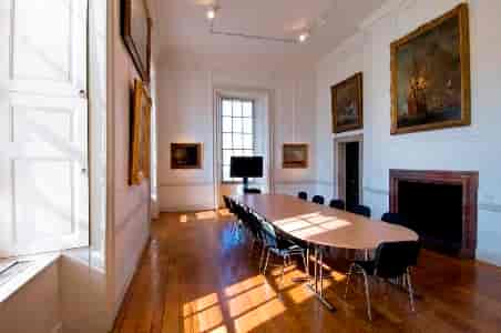 Elegant meeting room in The Queen's House with long table, ideal for events and presentations.