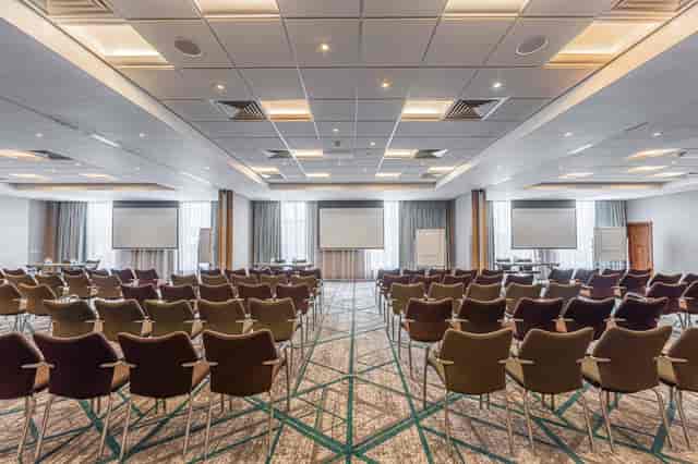 Buckingham Suite conference room with comfortable chairs, ideal for corporate events.