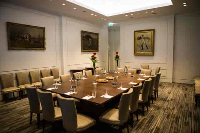 Presidents' Suite at Allianz Stadium: elegant meeting room with polished table for events.