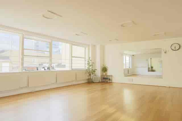 Bright, spacious London rehearsal studio with mirrors for workshops and yoga classes.