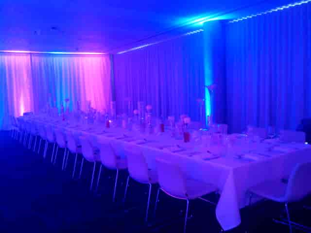 Long-table banquet with LED lighting at INNSIDE Manchester for corporate events or formal dinners.