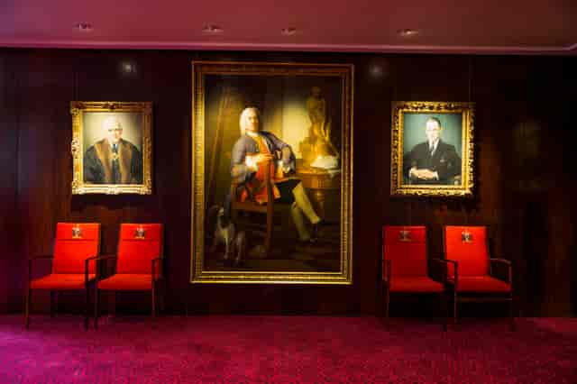 Elegant Court Room in Salters' Hall with plush red seating for exclusive events.