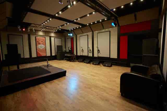 Rehearsal studio in London with acoustic panels for live performances and workshops.