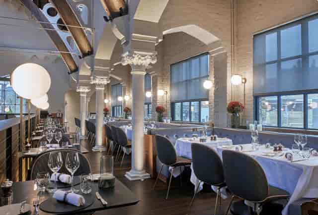 Semi-private dining room at German Gymnasium, ideal for upscale events and corporate dinners.