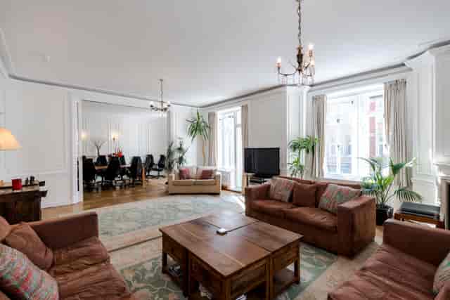 Elegant boutique boardroom with natural light, ideal for meetings and networking events.