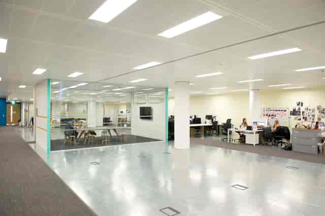 Howard Hughes open-plan office with flexible furniture for corporate event space and meetings.