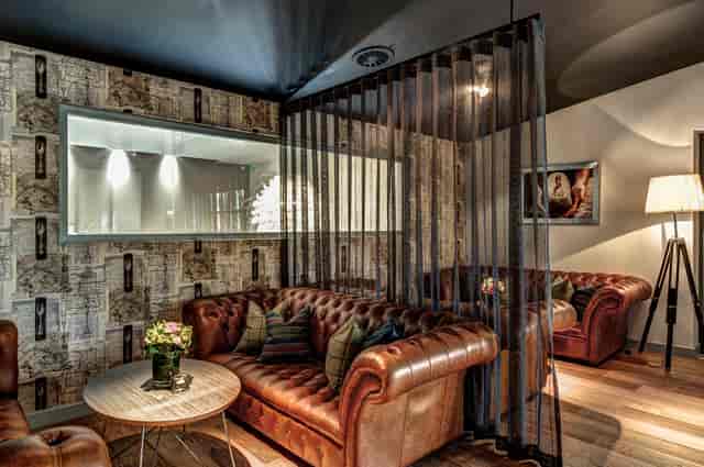 Stylish lounge with leather seating, ideal for networking events and informal meetings.