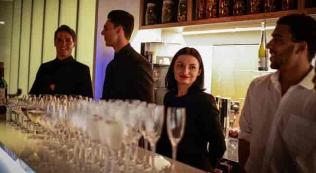 Lounge staff at SpitfireHouse bar, ready for exceptional event service.