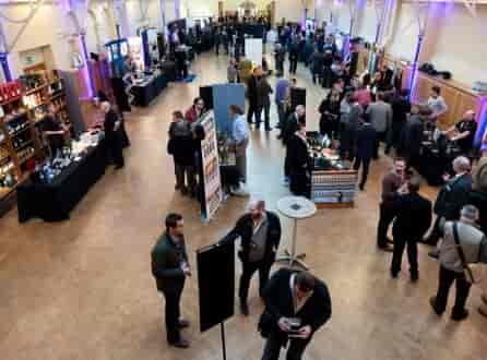 Prince Consort Rooms at HAC, bustling networking event with ambient lighting and booths.