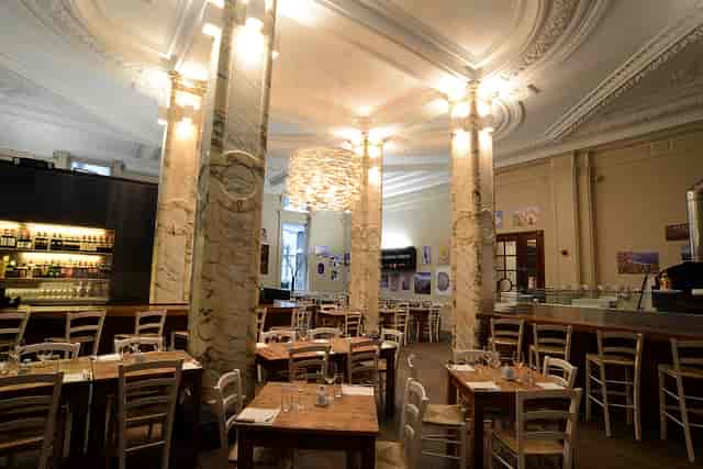 Chandelier Room at The Grand: elegant dining space for intimate meetings and small events.