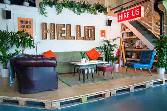 Vibrant meeting space with cozy seating for creative brainstorming events.