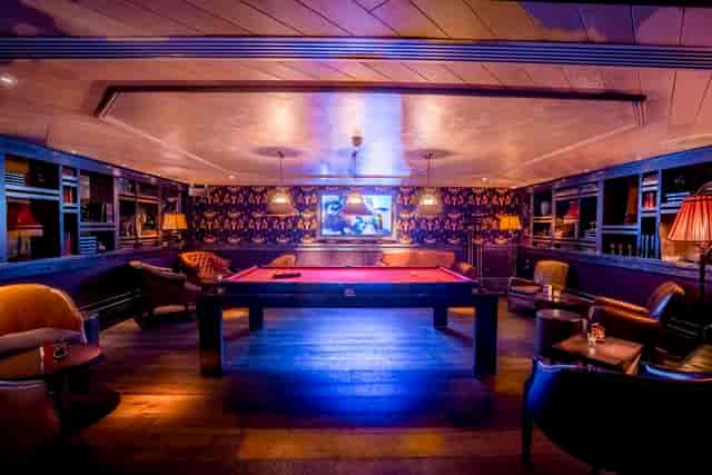 Stylish lounge with pool table at 100 Wardour Street for networking and casual meetings.