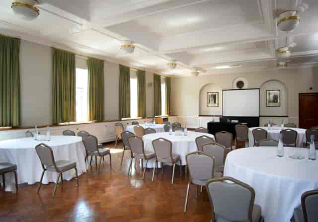 London House Large Common Room with round tables, ideal for workshops and conferences.