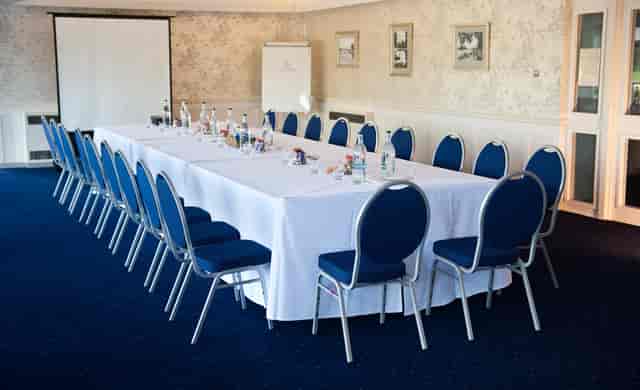 Thames Suite meeting room with blue chairs, ideal for conferences and workshops.