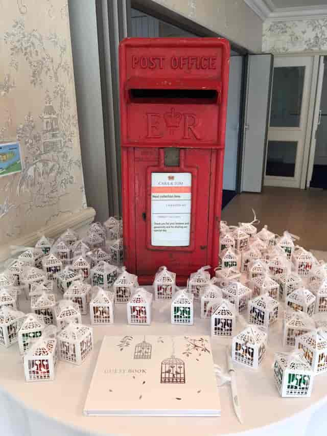 Thames Suite on Ravens Ait Island with red post box and white lanterns for events.