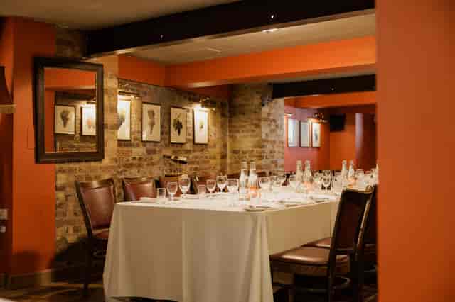 Wine Cellar Room at Bleeding Heart, elegant table setting for corporate dinners and events.