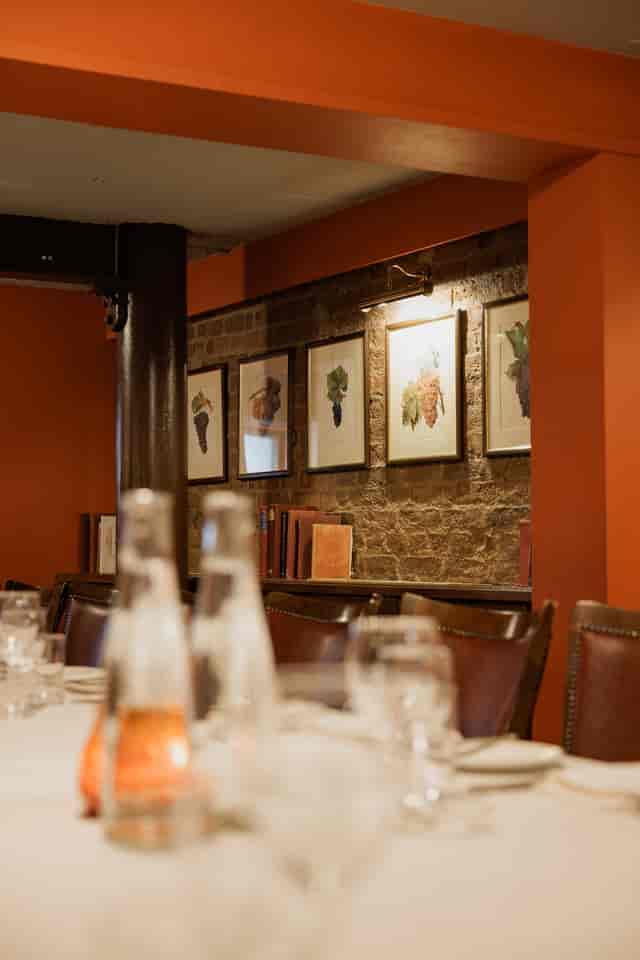 Wine Cellar Room at Bleeding Heart, rustic brick wall, ideal for corporate meetings.