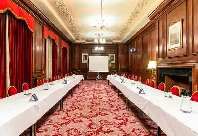 Main Lounge in Manchester Hall, elegant wood paneling, ideal for meetings and workshops.
