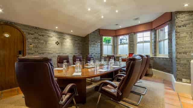 Large Study at Petersham Hotel with oval table, ideal for meetings and presentations.