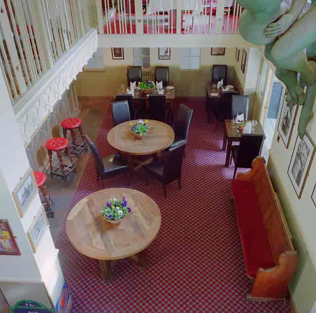 Gothic Bar & Restaurant event space with round tables, ideal for intimate gatherings and receptions.