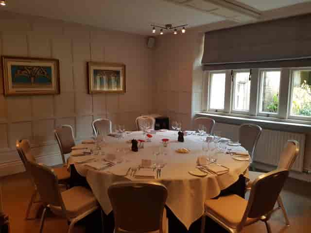 Chalfont Suite meeting room with elegant round table, ideal for intimate gatherings and events.