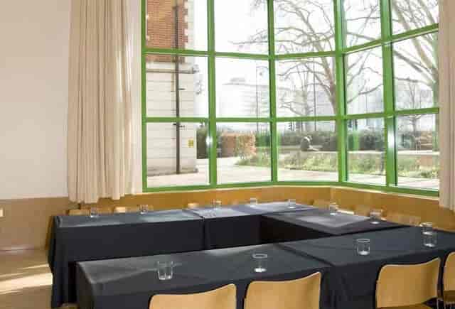 The Duffield Room at Tate Britain with unique green windows, ideal for workshops.