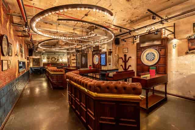 Stylish event space in Flight Club Shoreditch with rustic charm, ideal for networking events.