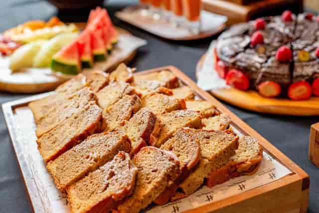 Balmoral Suite catering at Holiday Inn London, featuring vibrant fruit and cake for events.
