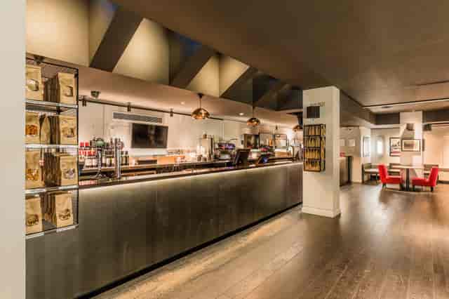 Curzon Soho bar area with polished counter, ideal for networking events and meetings.