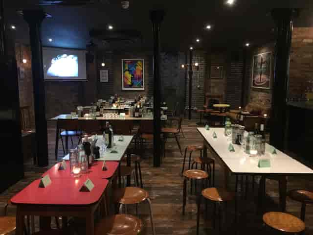 Basement Bar event space with ambient lighting for networking and dining gatherings.