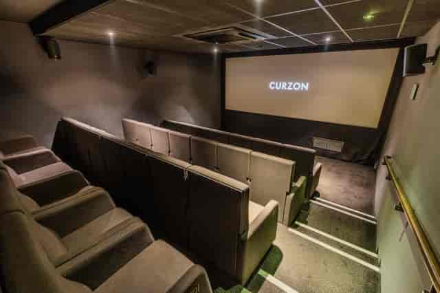 Modern screening room with tiered seating for private events at Curzon Bloomsbury.