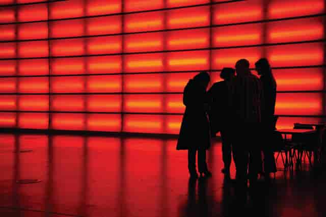 Professionals collaborating in The Red Hall, MAGNA for networking and brainstorming events.