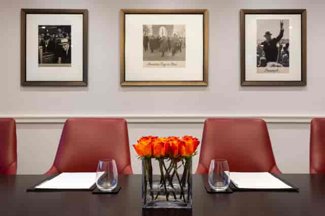 Boardroom 2 at Hyatt Regency London with elegant red chairs for corporate meetings.
