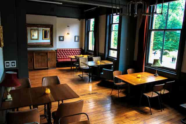 Stylish event space with wooden floors, ideal for workshops and networking sessions.