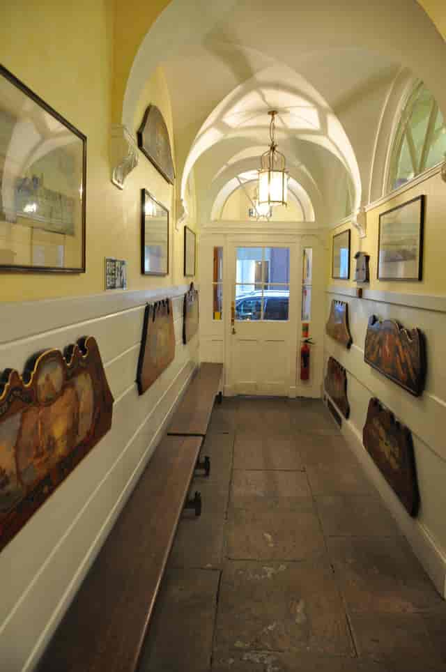 Silver Room hallway with artwork, ideal for networking events and gatherings.