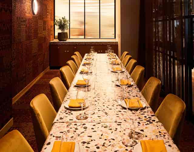 Private dining room with elegant table settings for corporate dinners and intimate gatherings.