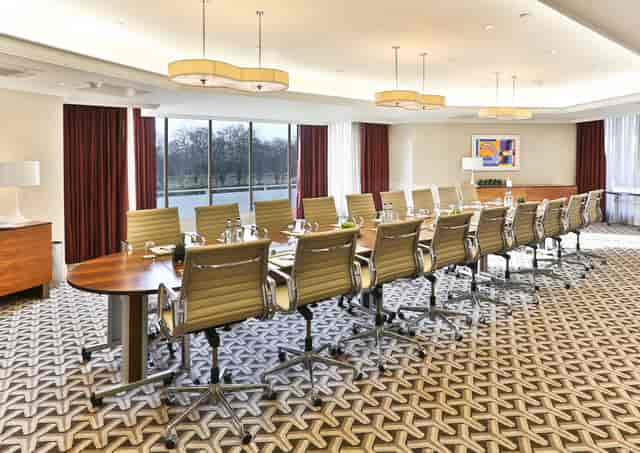 Serpentine Suite conference room with polished table, ideal for corporate events in London.