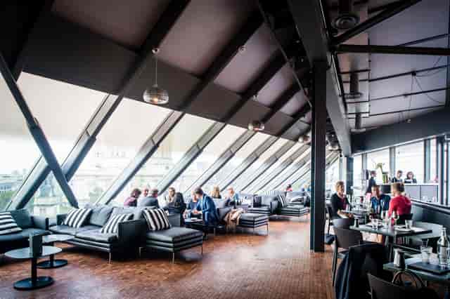 Modern event space in Madison with large windows, perfect for corporate gatherings and social events.